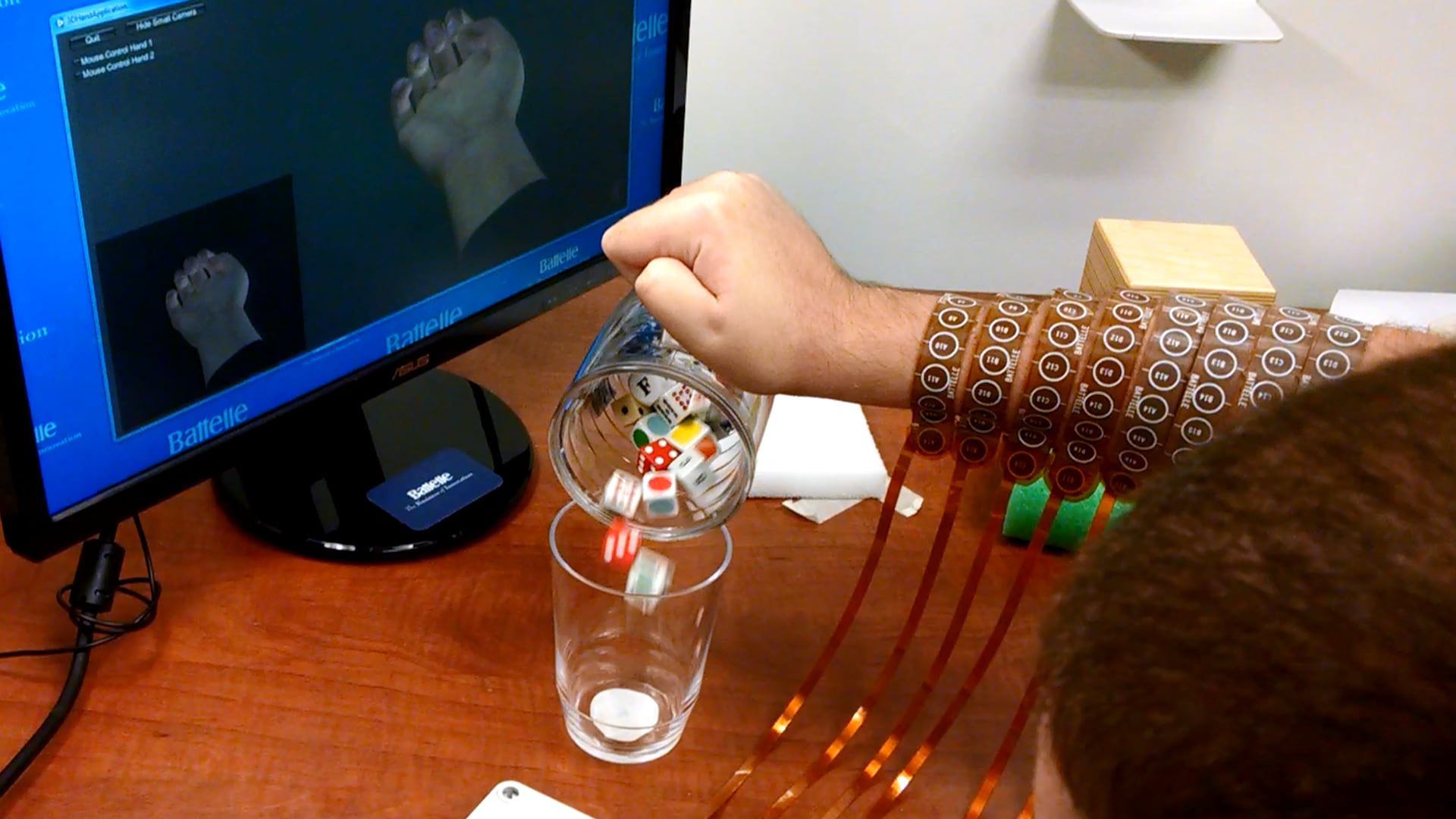 Man's Arm Pours Dice from One Cup to Another using Brain Computer Interface