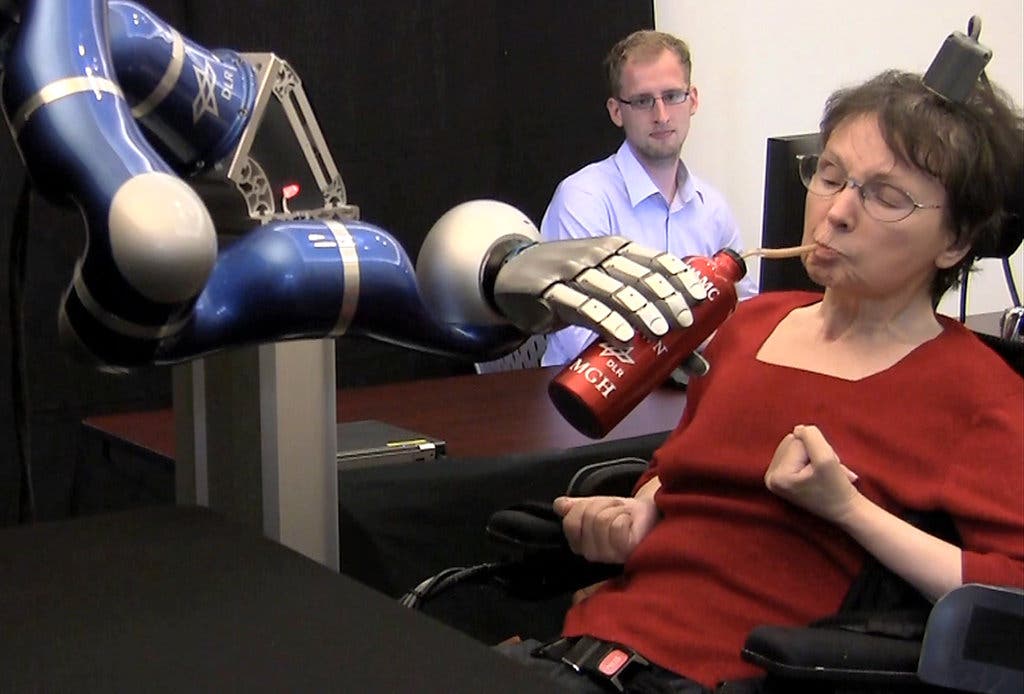 Cathy Hutchinson with robotic arm